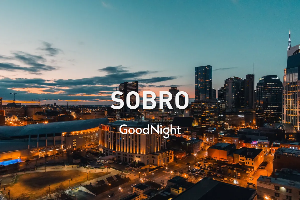 A stunning view of the city skyline during sunset, with prominent buildings illuminated against the inviting evening sky. The image radiates an urban vibrancy and highlights the scenic potential of rooftop spaces.